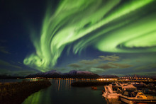 Amazing view of aurora borealis ( northern lights) over Norvegian sea . 