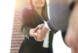 © ASDF - Close up of businessman and businesswoman shaking hands