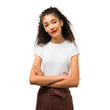 © luismolinero - Young girl with curly hair having doubts and with confuse face expression while bites lip. Questioning an idea on white background