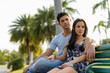 © Ranta Images - Young Hispanic couple relaxing in the park together