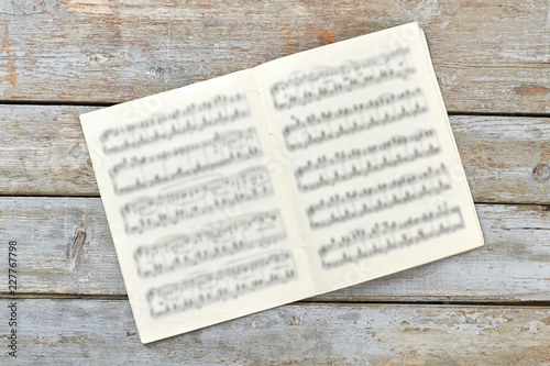 Fotografía Musical notes book on rustic background