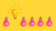 One outstanding idea concept with yellow and pink light bulbs