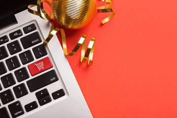 Fototapete - Computer notebook keyboard with icon shopping cart