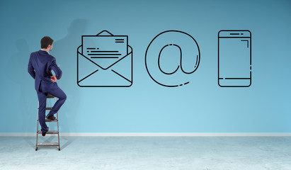 Poster - Businessman watching contact icon on a wall