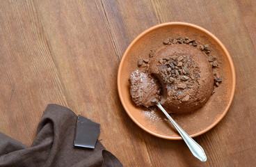 Wall Mural - Cocoa panna cotta decorated with black grated chocolate, delicious dessert