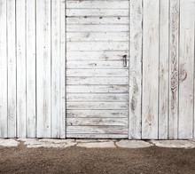 White Old Shabby Wooden Door In Aged Wooden Wall, Exterior Of Tool Shed For Vegetable Garden, Copy Space Blank Template Background