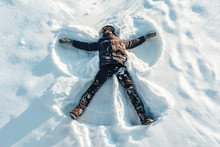 The Boy On A Snow Flapping Arms And Legs Angel Shows