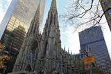 Fototapeta Miasta - New York, USA - November 20: View of the facade of St. Patrick's Cathedral and skyscrapers in New York City,