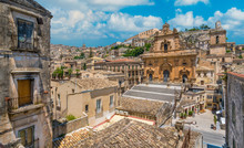 Scenic Sight In Modica With The Cathedral Of San Pietro And The Duomo Of San Giorgio In The Background. Sicily, Southern Italy.