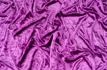 Texture, background of folded purple satin fabric