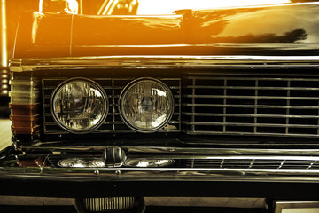 Wall Mural - old classical car of white-blue color. macro front view. sunshine