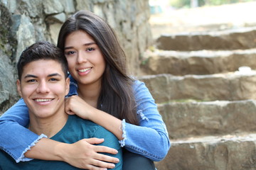 Wall Mural - Young couple cuddling close up