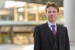 © Ranta Images - Businessman standing in front of modern building