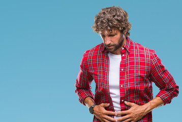 Wall Mural - Handsome hispanic model man over isolated background with hand on stomach because indigestion, painful illness feeling unwell. Ache concept.