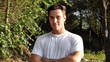 © theartofphoto - Handsome athletic young man in nature smiling, in a sunny, peaceful day, looking at camera