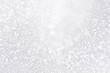 Silver and white snow confetti sparkle background