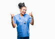 Young braided hair african american girl professional surgeon over isolated background success sign doing positive gesture with hand, thumbs up smiling and happy. Looking at the camera 