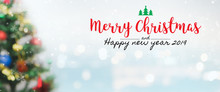 Christmas And Happy New Year 2019 On Blurred Bokeh Christmas Tree Banner Background With Snowfall.