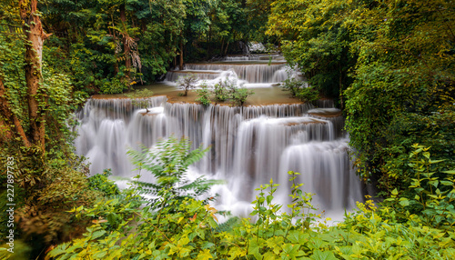 Beautiful waterfall in deep forest © Naypong Studio