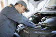 © Minerva Studio - Mechainc fixing a van engine