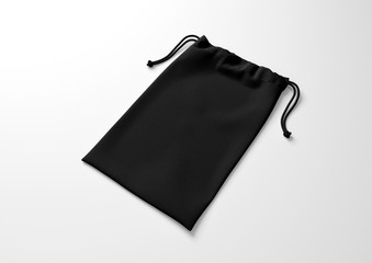 Wall Mural - Black drawstring bag on white background. Fabric cotton small bag. Isolated pouch.