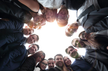 Wall Mural - large business team is forming a circle and looking at the camera