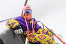 Beautiful Young Woman In Retro Vintage Outfit In The Chairlift On A Foggy Winter Day In The Alps In The Brandnertal, Vorarlberg Austria