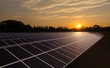 Solar panels with sunrise, warm sky