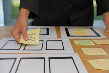 user experience ux designer designing web on smartphone tablet layout. ui planning mobile applicatio