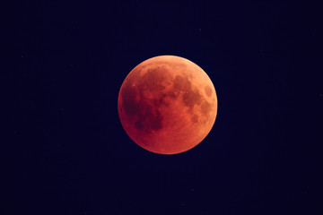 Wall Mural - super bloody moon, full eclipse phase against starry sky background