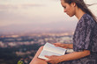 © PhotoGranary - Christian worship and praise. A young woman is reading the bible.