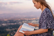 © PhotoGranary - Christian worship and praise. A young woman is reading the bible.