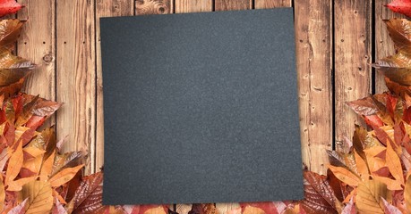 Poster - Autumn leaves border with dark copy space on wood