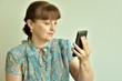 © st_fox - woman holding smartphone
