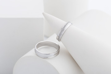 Pair of white gold wedding rings with diamonds in womens ring