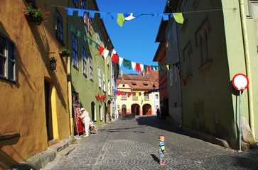 Medieval and colorful street in Sighisoara, the UNESCO world heritage town, Romania