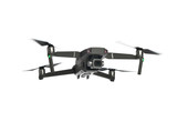 Fototapeta Sport - New dark grey drone quadcopter with digital camera and sensors flying isolated on white