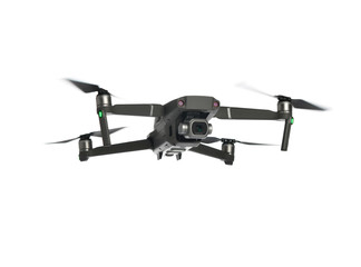 New dark grey drone quadcopter with digital camera and sensors flying isolated on white