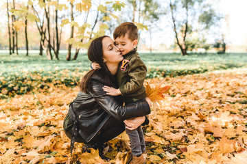 mother and son in autumn park