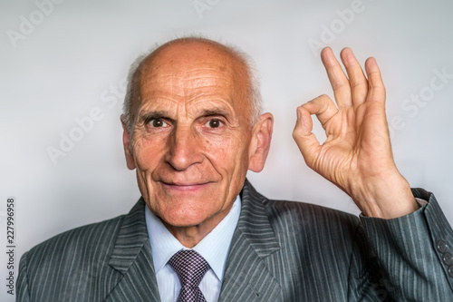 Old Man In Suit And Tie Shows Ok Good Mood No Problems Health