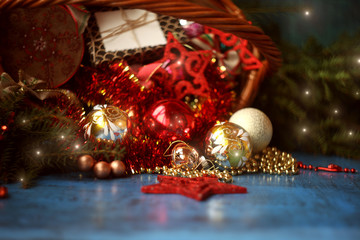 Wall Mural - Christmas decoration in wicker basket with fir branches on the wooden board.Christmas and New year card