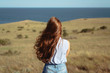 © Shevgeniya - Long hair girl on a nature background.