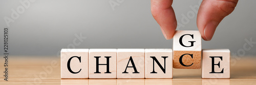 Cuadros en Lienzo Hand flip wooden cube with word change to chance, Personal development and c
