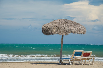 Wall Mural - Beach umbrellas on Caribbean sea