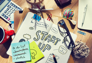 Wall Mural - start up drawn in a notebook on a messy table