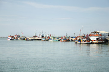 Fishing boat and ship floating in the sea for waiting fishing in night time at Ang Sila in Chonburi, Thailand