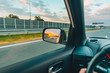© phpetrunina14 - first-person point of view. sunset in car mirror