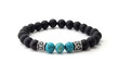 Unpolished black onyx bracelet with turquoise beads isolated on white background