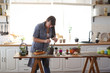 © natalialeb - florist transplants succulents on kitchen in real