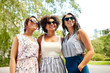 © Syda Productions - female friendship, people and leisure - happy young women in sunglasses at summer park